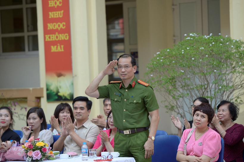 A picture containing person, group, people, posing

Description automatically generated