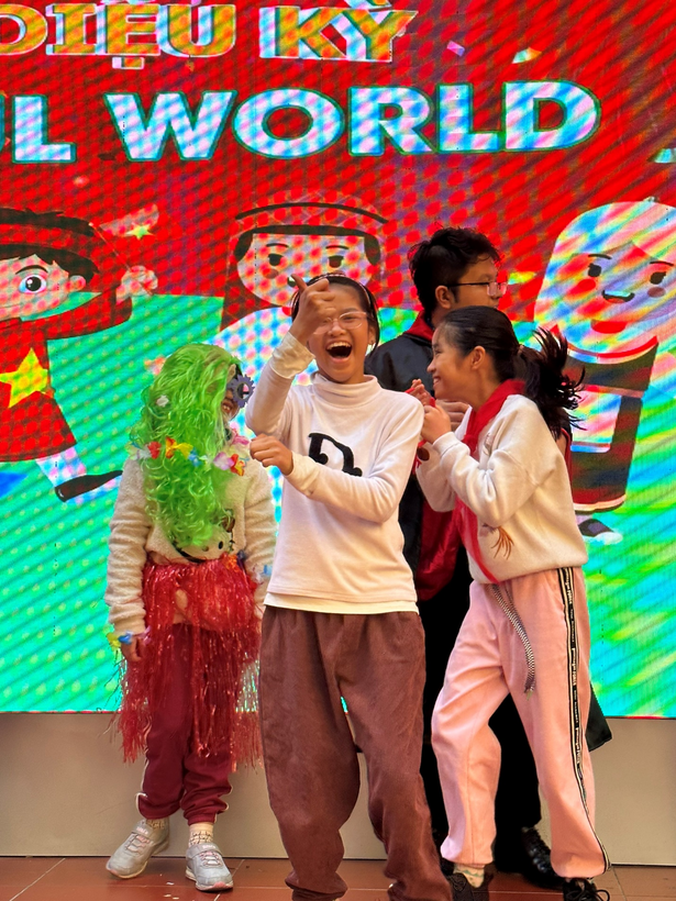 A picture containing text, person, standing, colorful

Description automatically generated