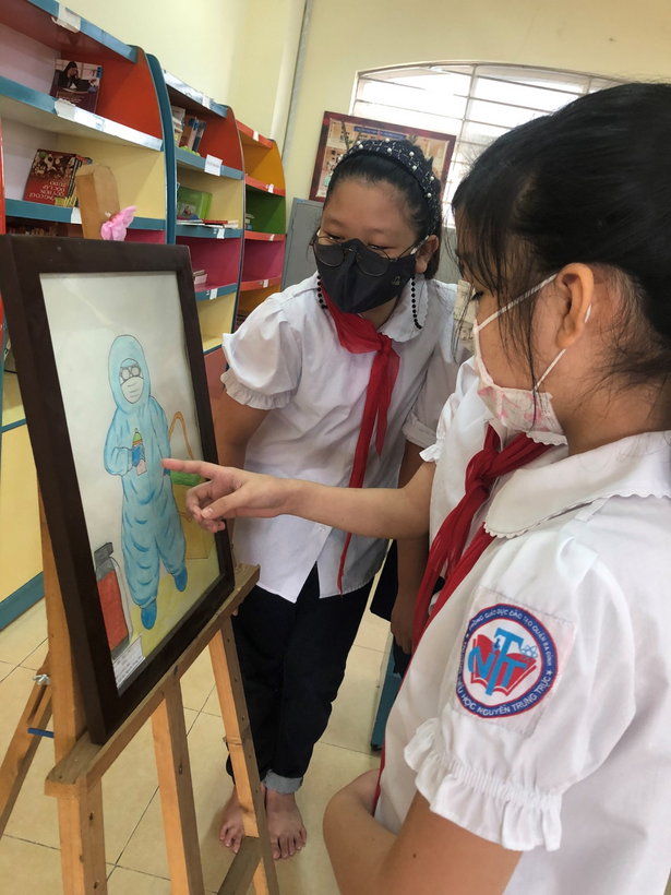 A picture containing text, person, standing
Description automatically generated