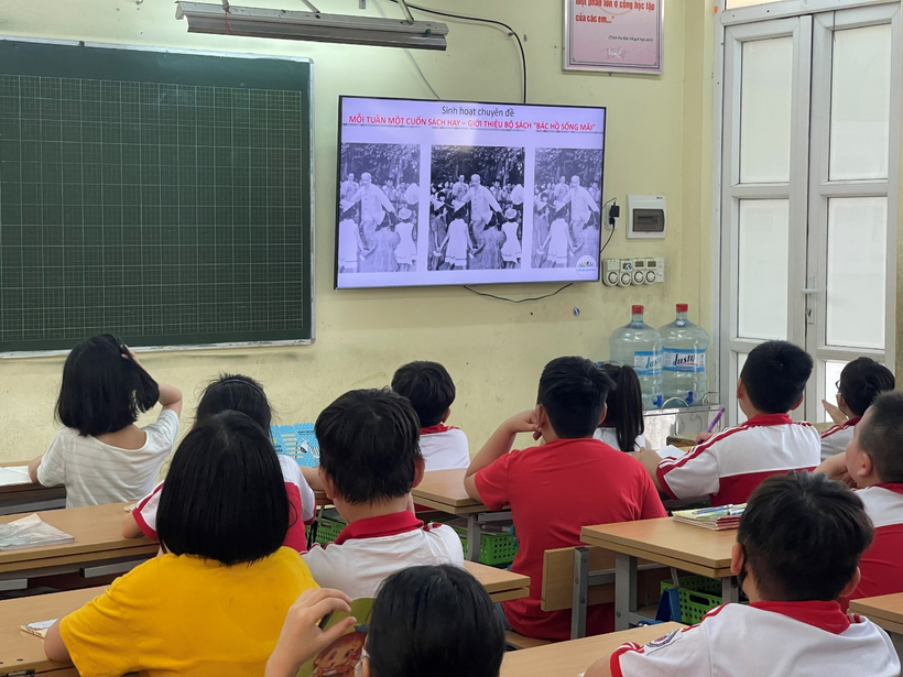 A picture containing text, person, group, scene
Description automatically generated