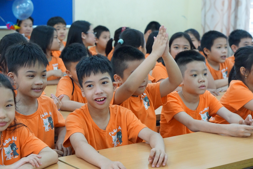 A group of children in orange shirts

Description automatically generated with medium confidence
