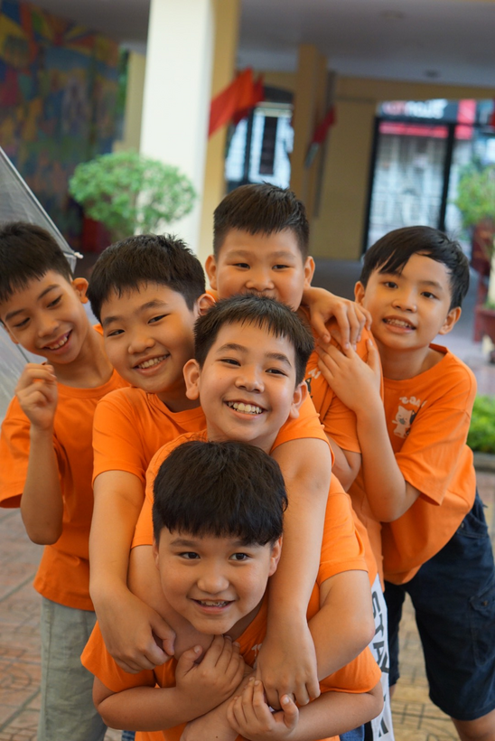 A group of boys posing for a photo

Description automatically generated with medium confidence