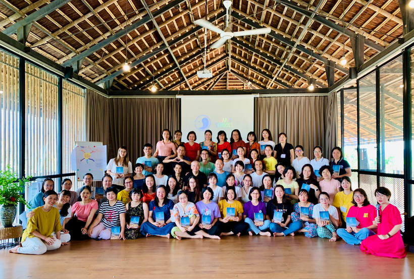 A group of people posing for a photo

Description automatically generated