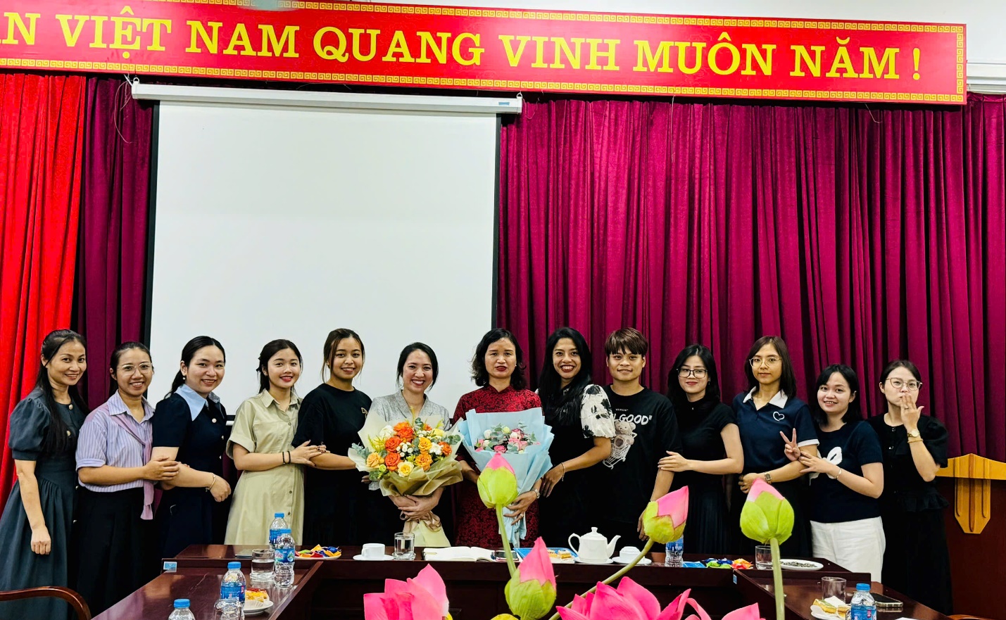 A group of women standing together

Description automatically generated