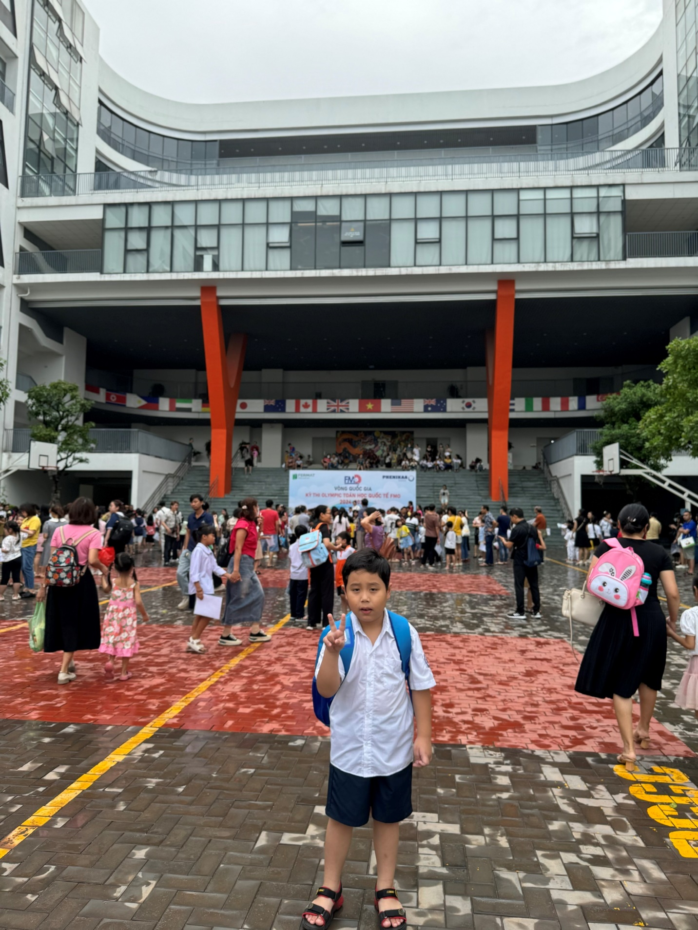 A child standing in front of a building
Description automatically generated