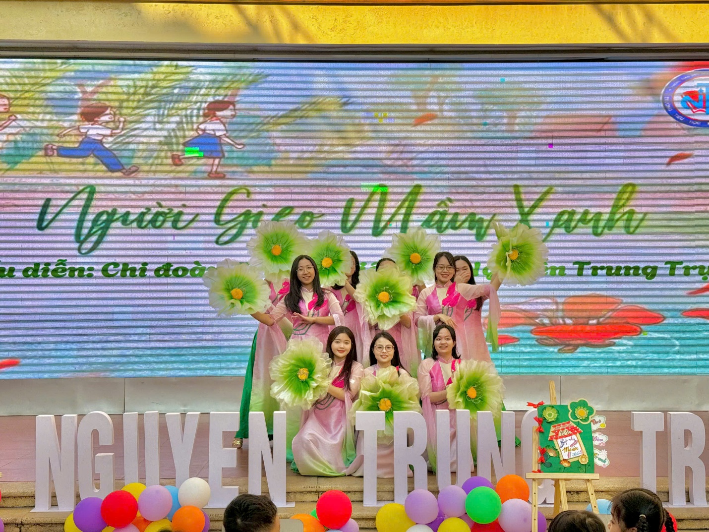 A group of women on stage

Description automatically generated