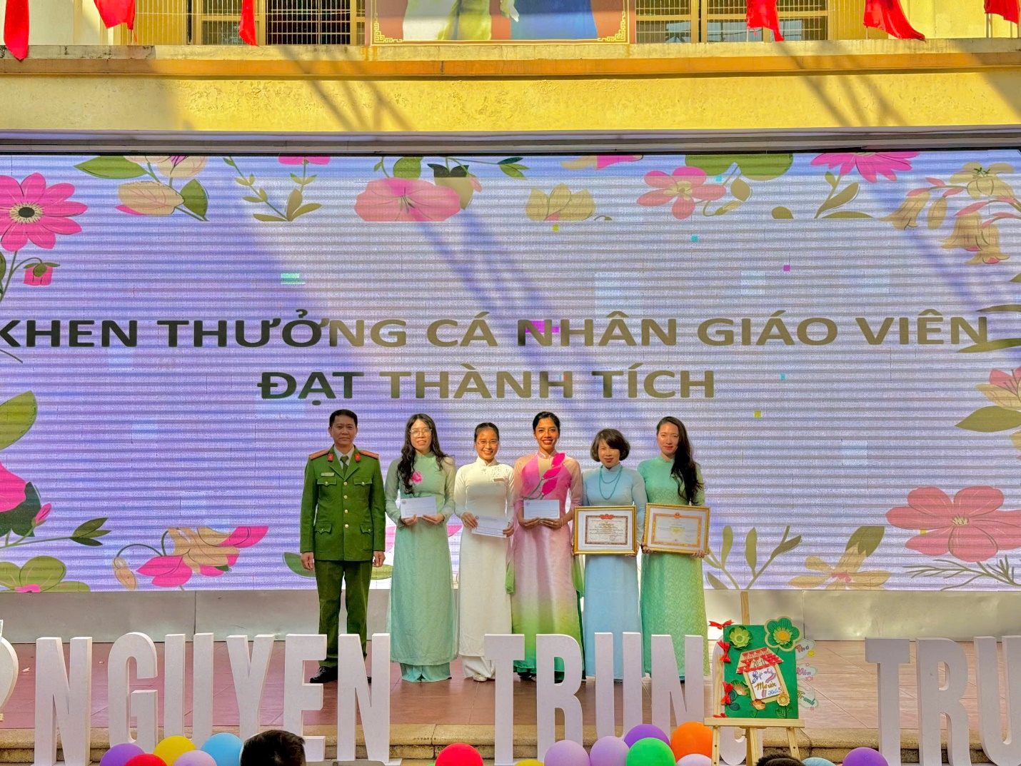 A group of people on a stage

Description automatically generated