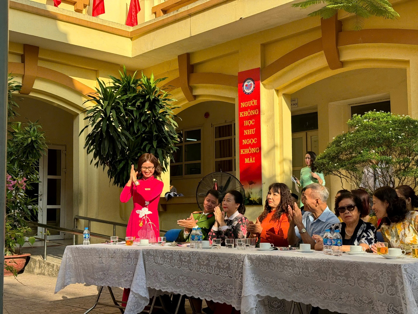 A group of people sitting at a table

Description automatically generated