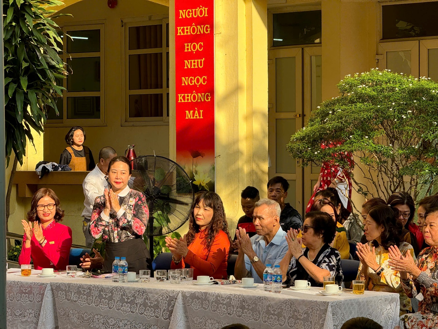 A group of people sitting at a table

Description automatically generated