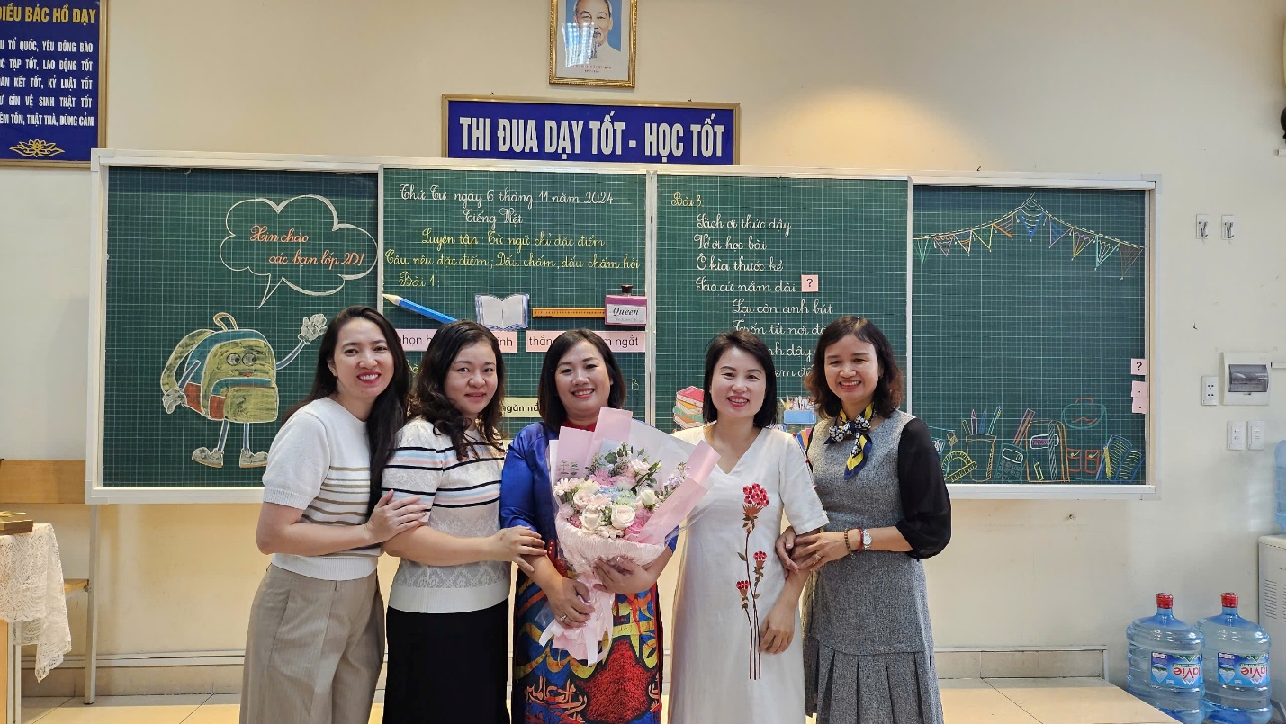 A group of women posing for a photo
Description automatically generated