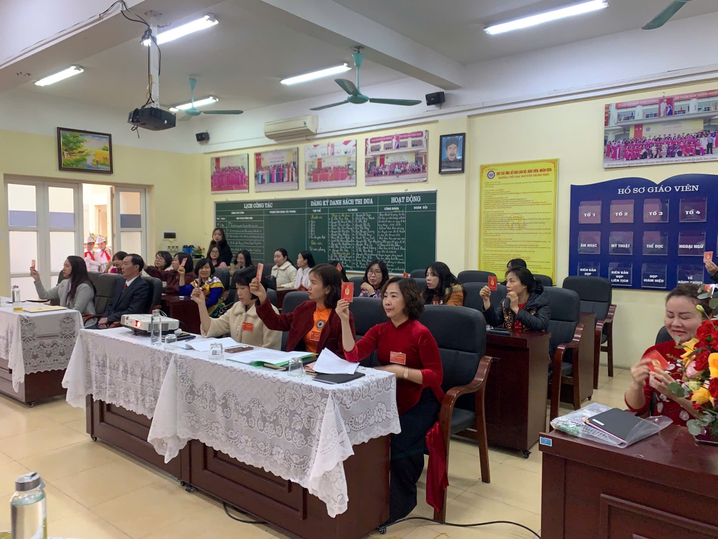 A group of people sitting at a table
Description automatically generated