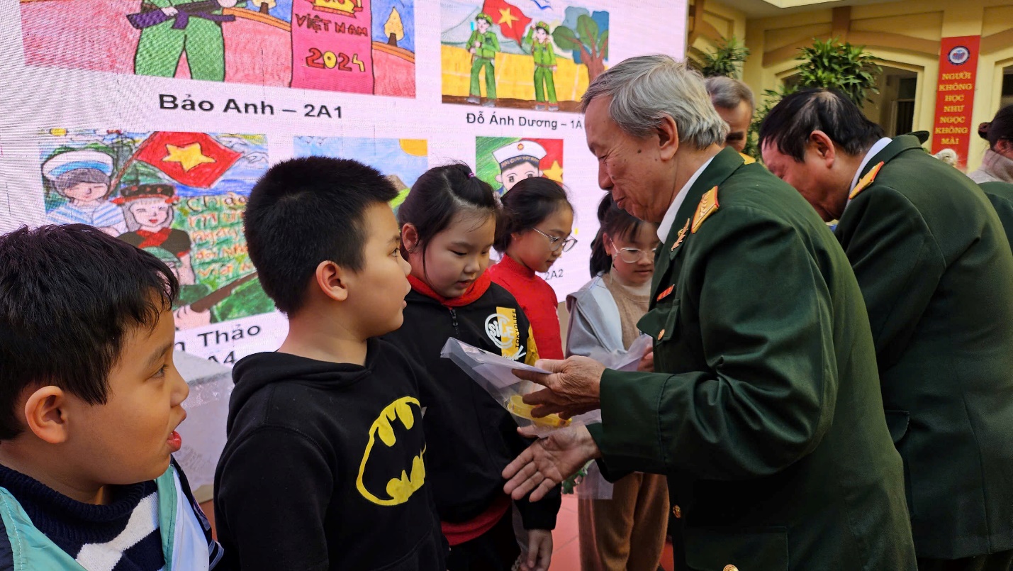 A person in a military uniform talking to a group of children
Description automatically generated