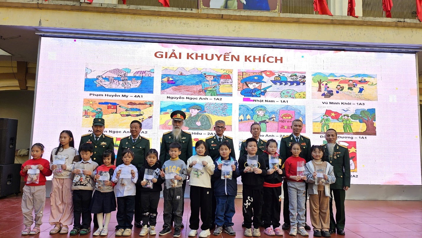 A group of people standing in front of a large sign
Description automatically generated