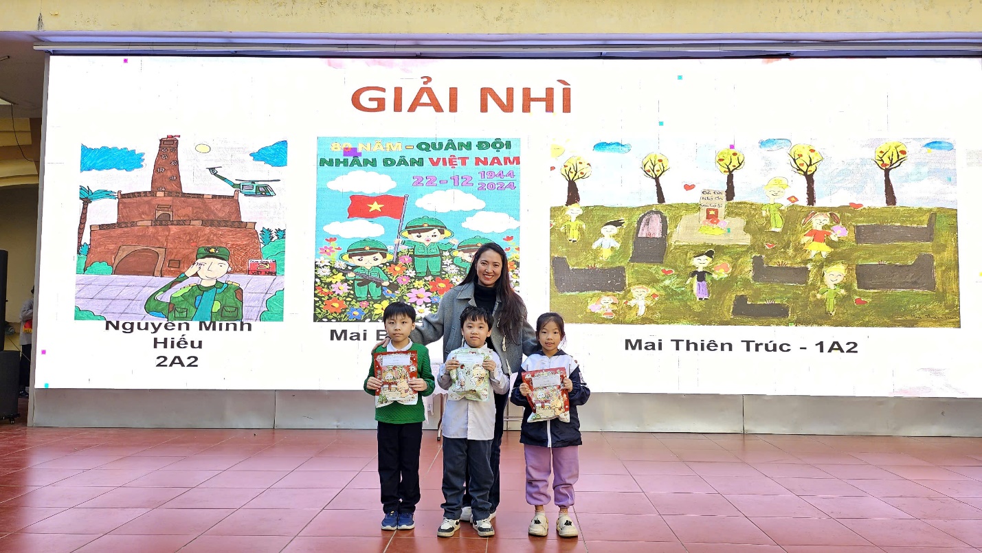 A person and children posing for a photo
Description automatically generated