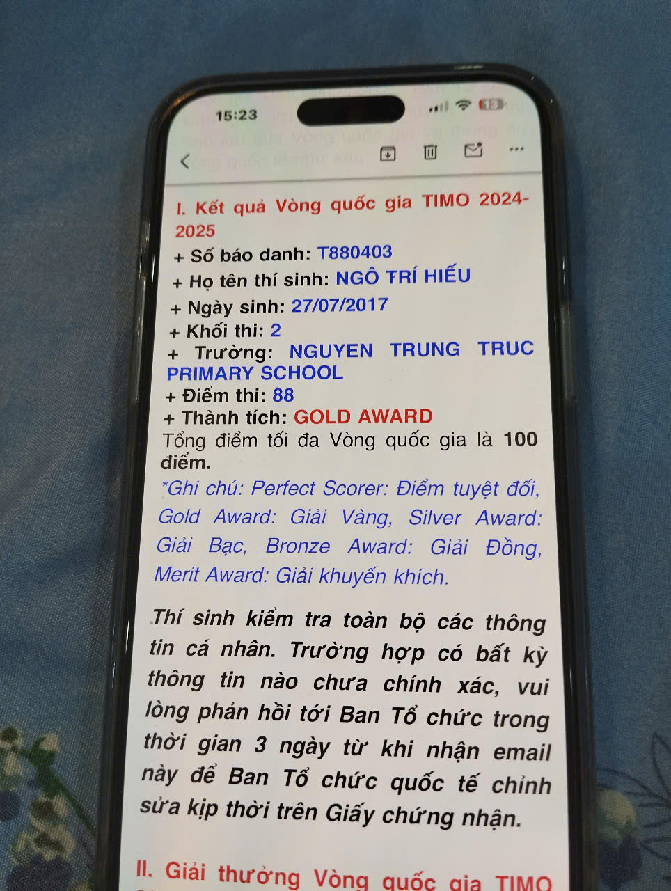A cell phone with text on it

Description automatically generated