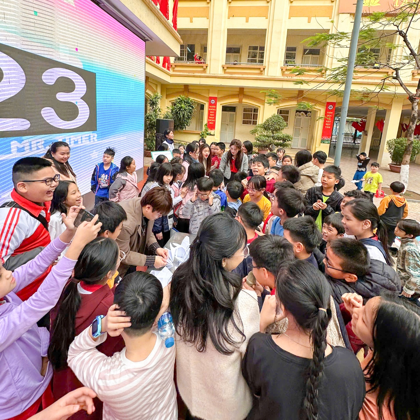 A group of people standing in a crowd

Description automatically generated