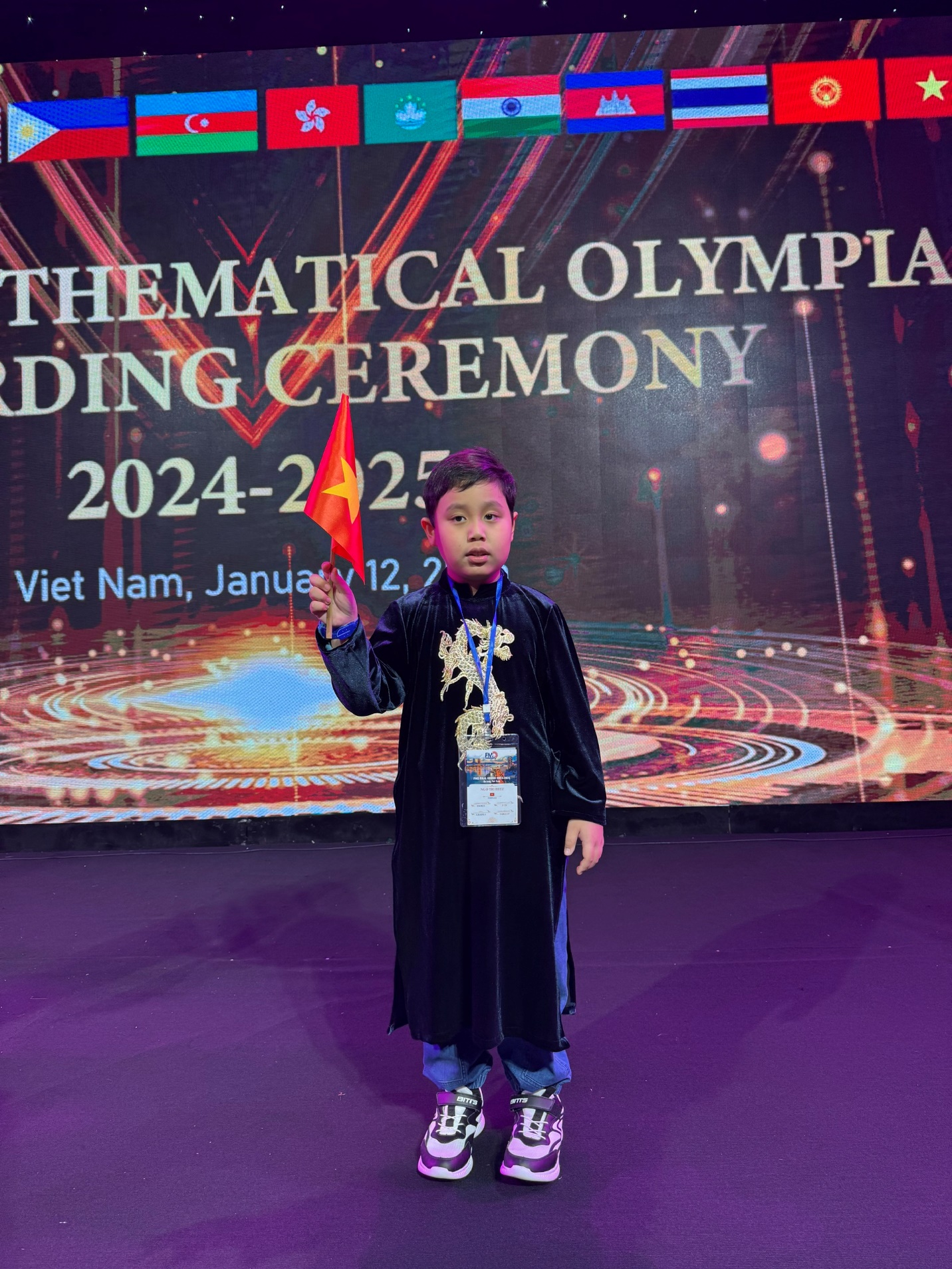 A child holding a flag

Description automatically generated