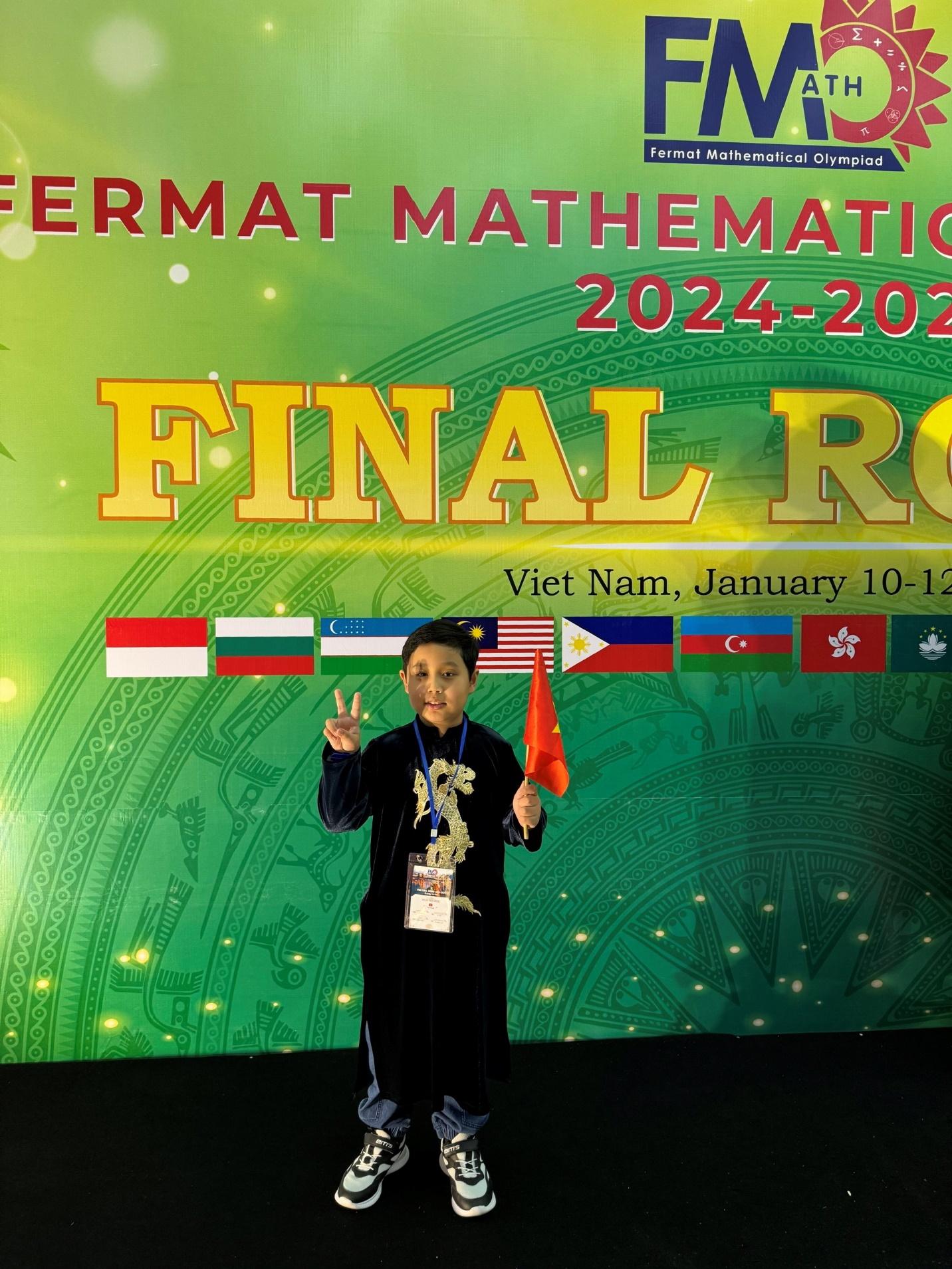 A child holding a flag

Description automatically generated