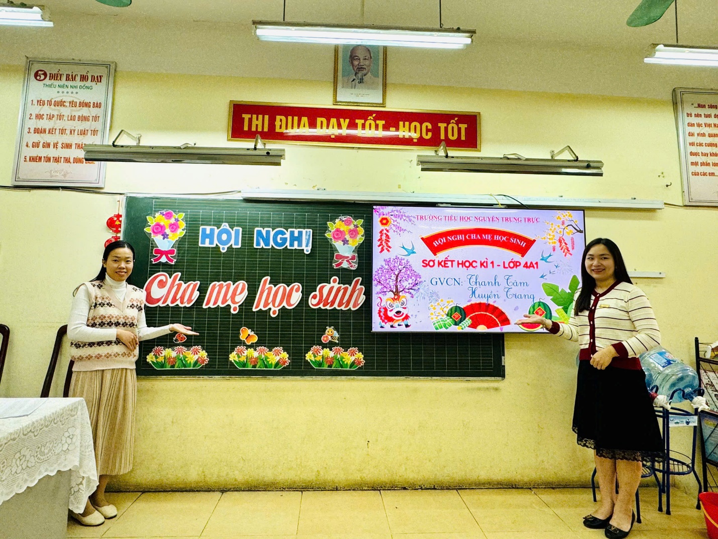 A group of women standing in front of a chalkboard

Description automatically generated