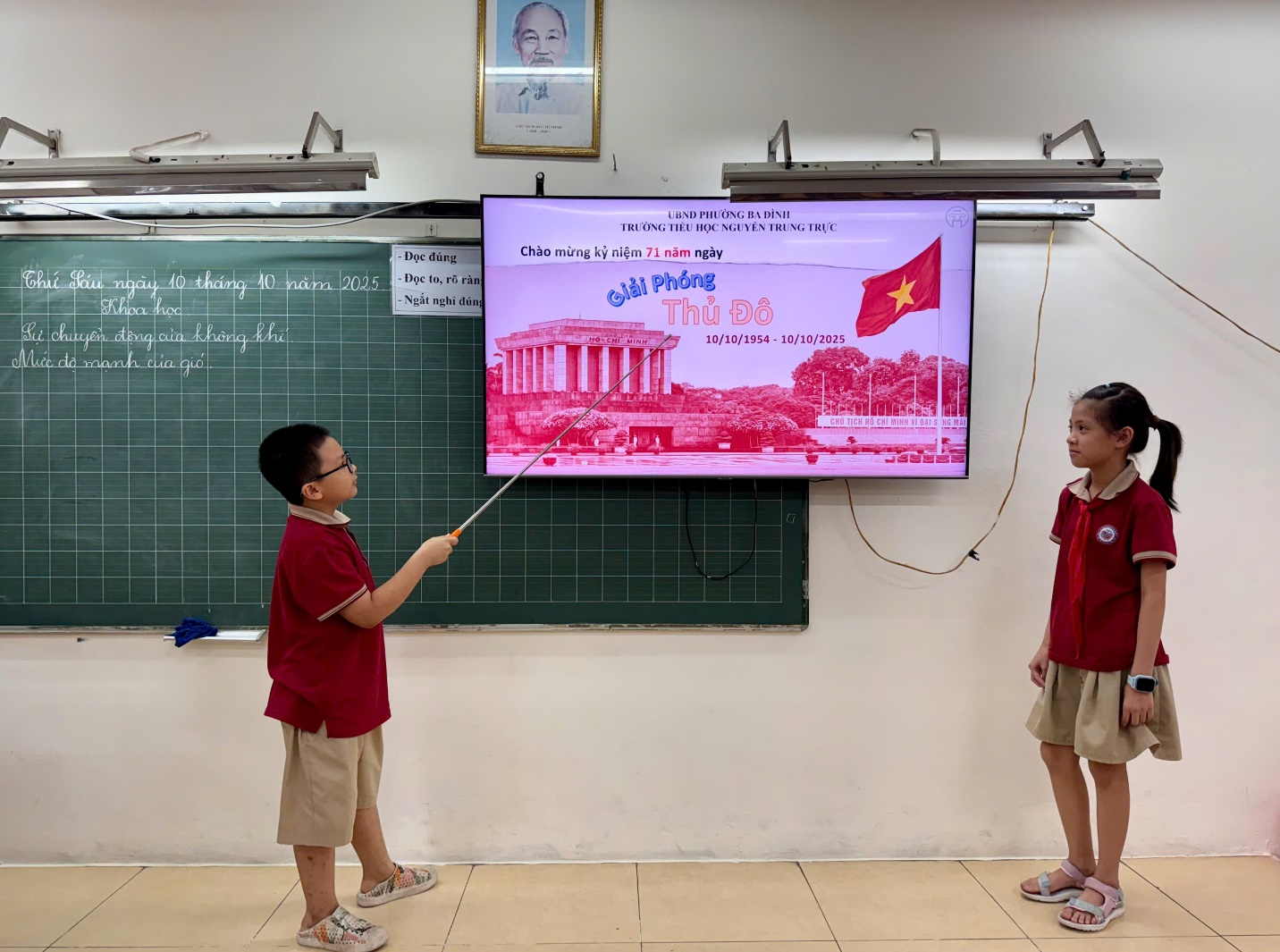 A child and child standing in front of a chalkboard
AI-generated content may be incorrect.