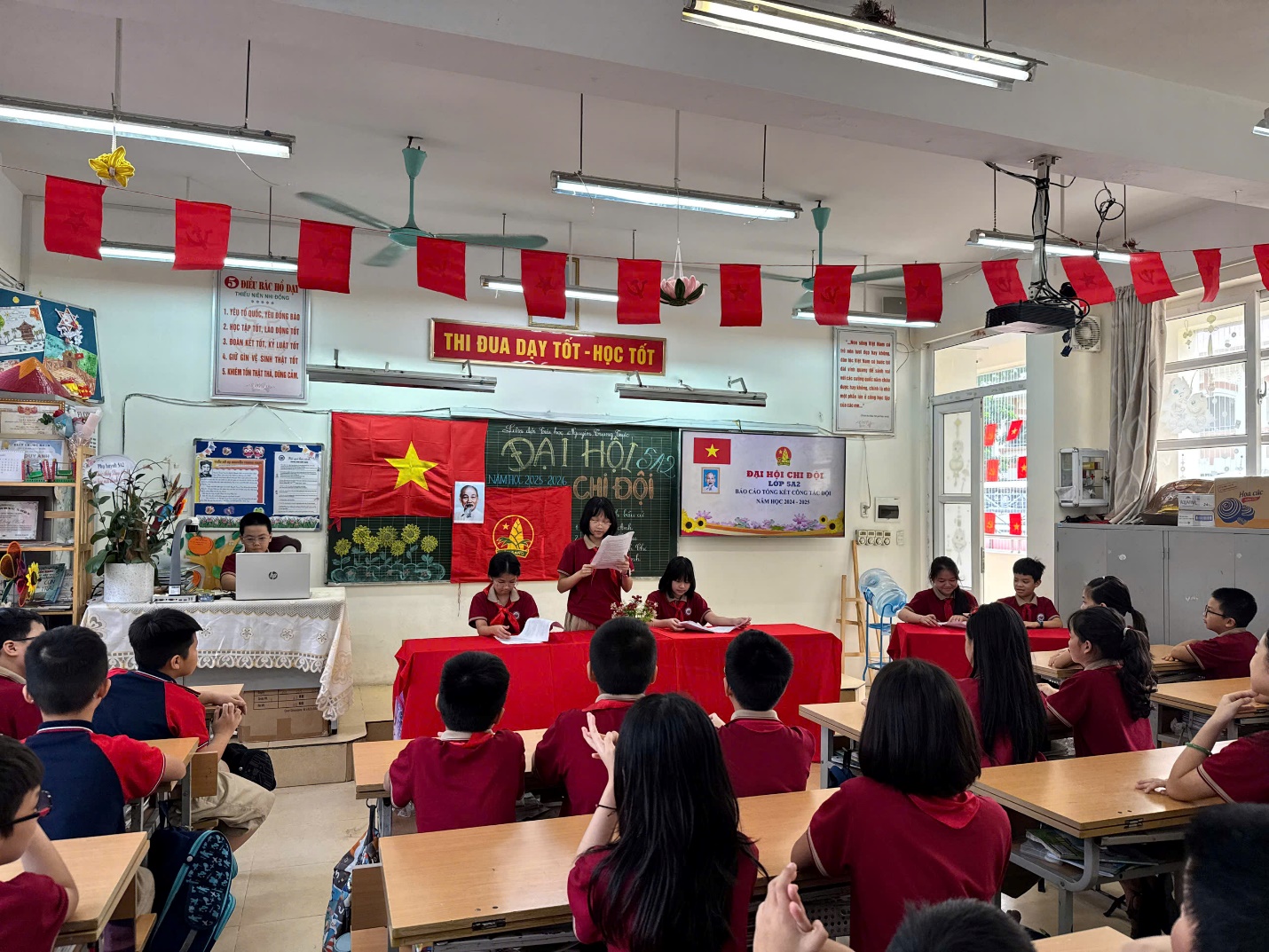 A classroom with students in red shirts

AI-generated content may be incorrect.