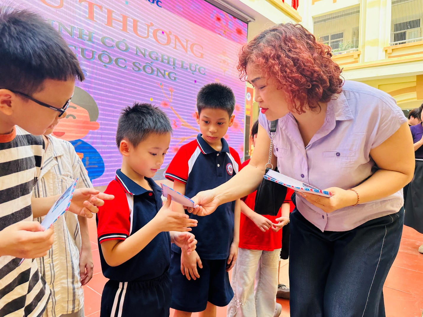 A person holding a book with a group of children

AI-generated content may be incorrect.