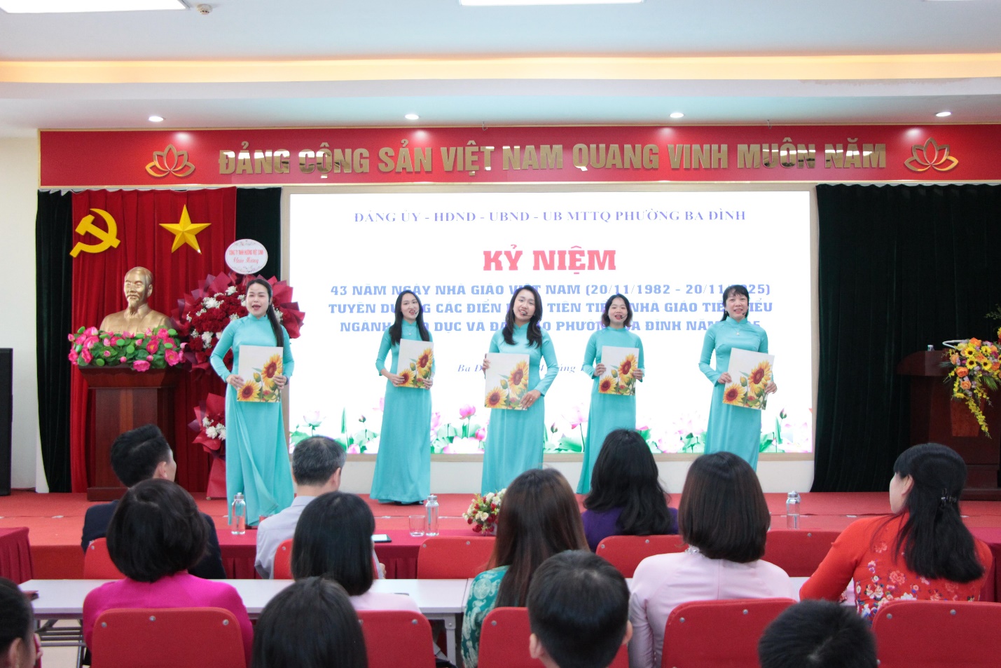 A group of women performing on stage

AI-generated content may be incorrect.