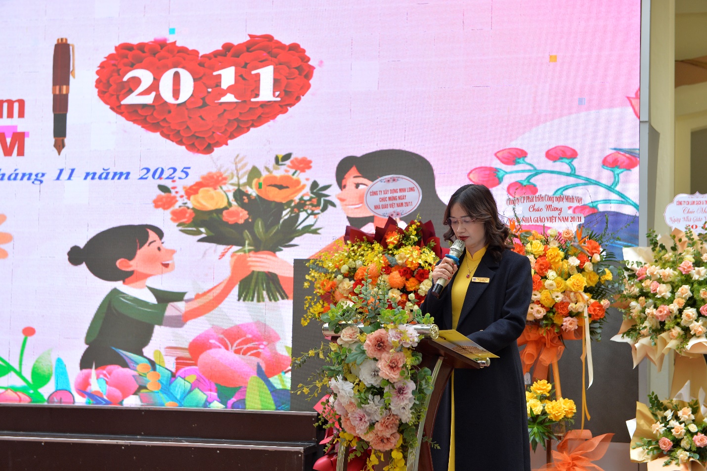 A person standing at a podium with a microphone

AI-generated content may be incorrect.