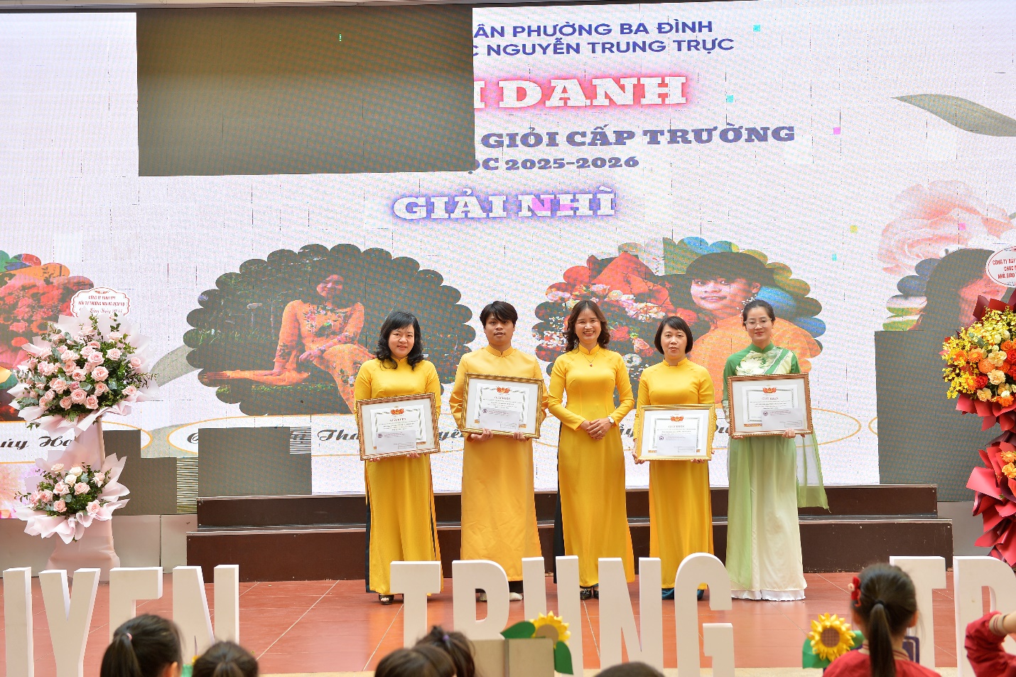 A group of women holding certificates

AI-generated content may be incorrect.