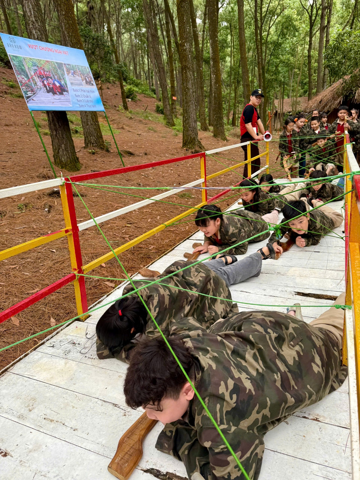 A group of people lying on a bridge

AI-generated content may be incorrect.