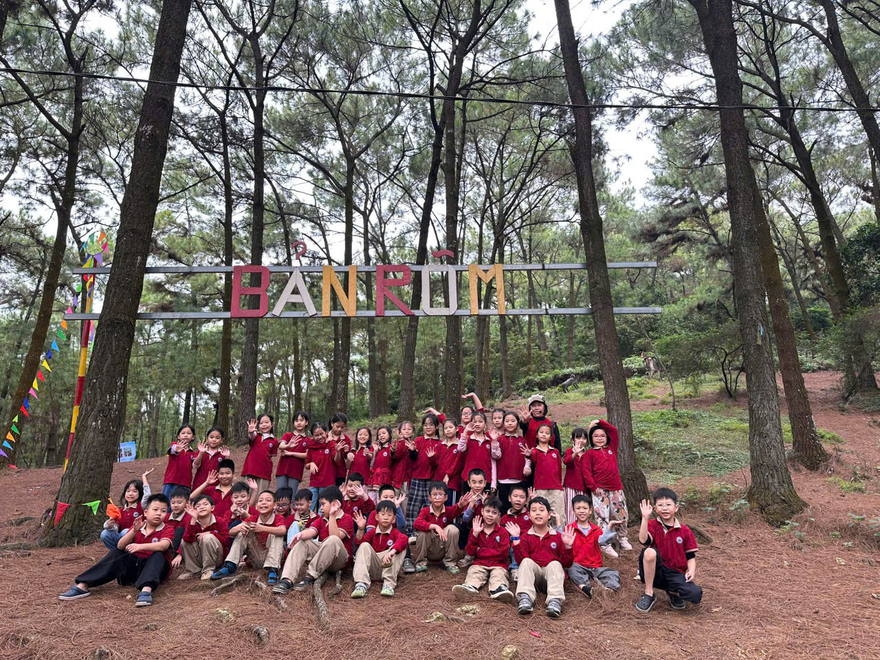 A group of children posing for a photo under a sign

AI-generated content may be incorrect.