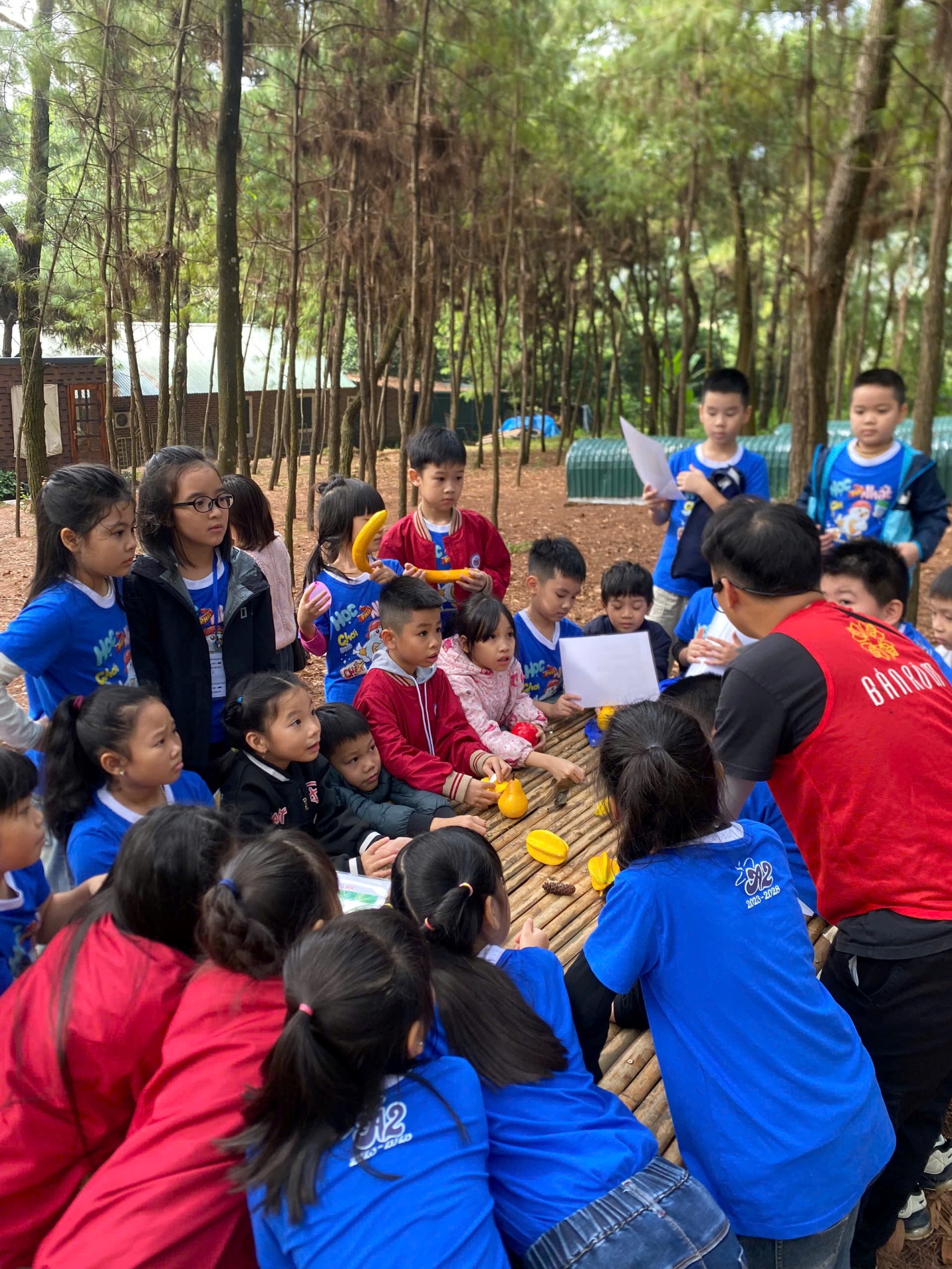 A group of children sitting around a table

AI-generated content may be incorrect.