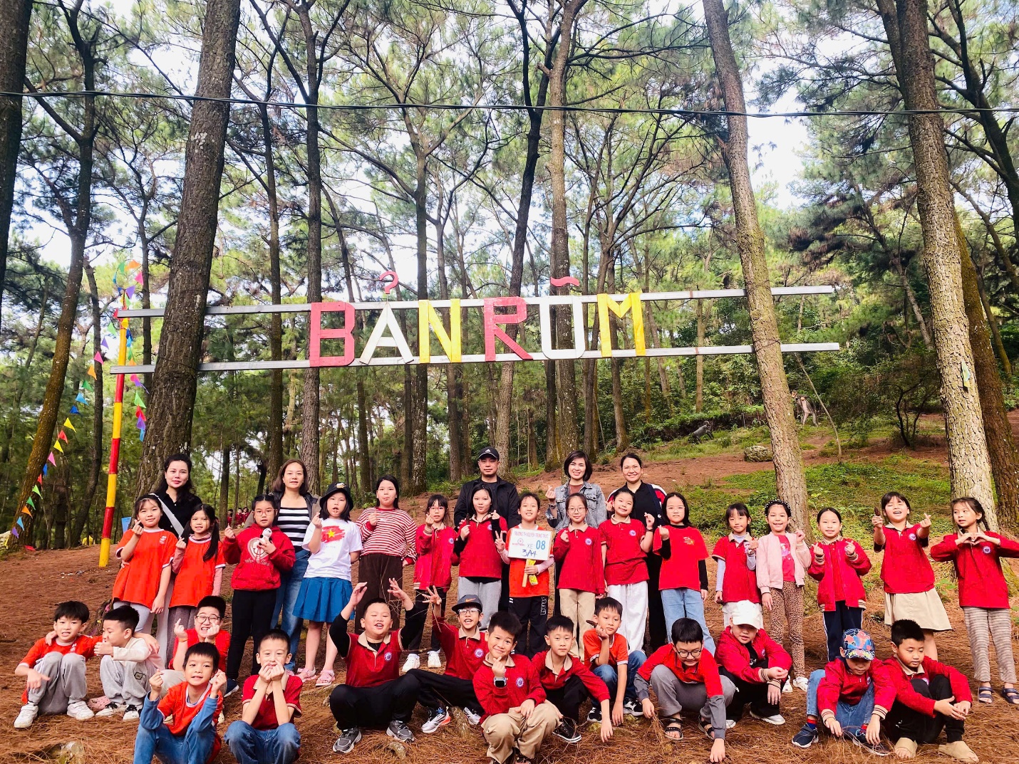 A group of people posing for a photo under a sign

AI-generated content may be incorrect.