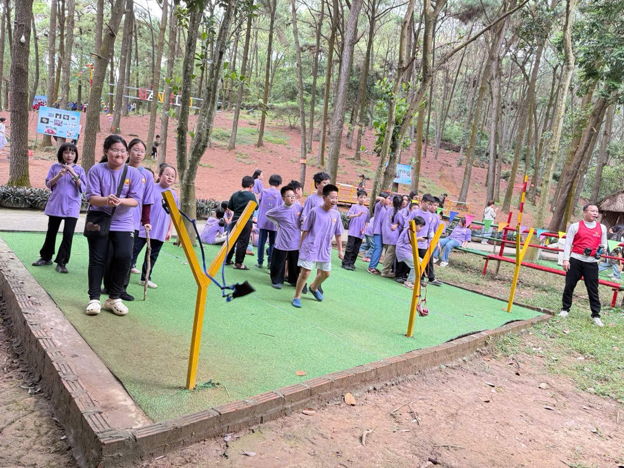 A group of people in purple shirts

AI-generated content may be incorrect.