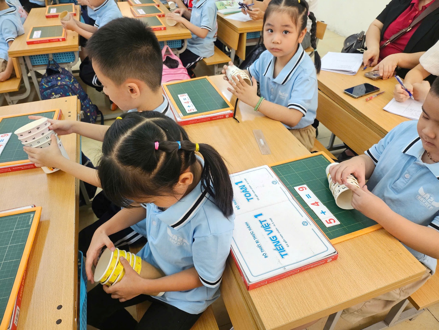 A group of children in a classroom

AI-generated content may be incorrect.