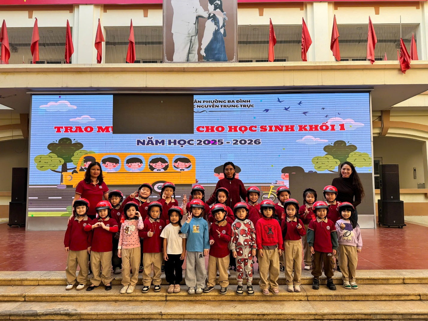 A group of children in red shirts and helmets posing for a photo

AI-generated content may be incorrect.