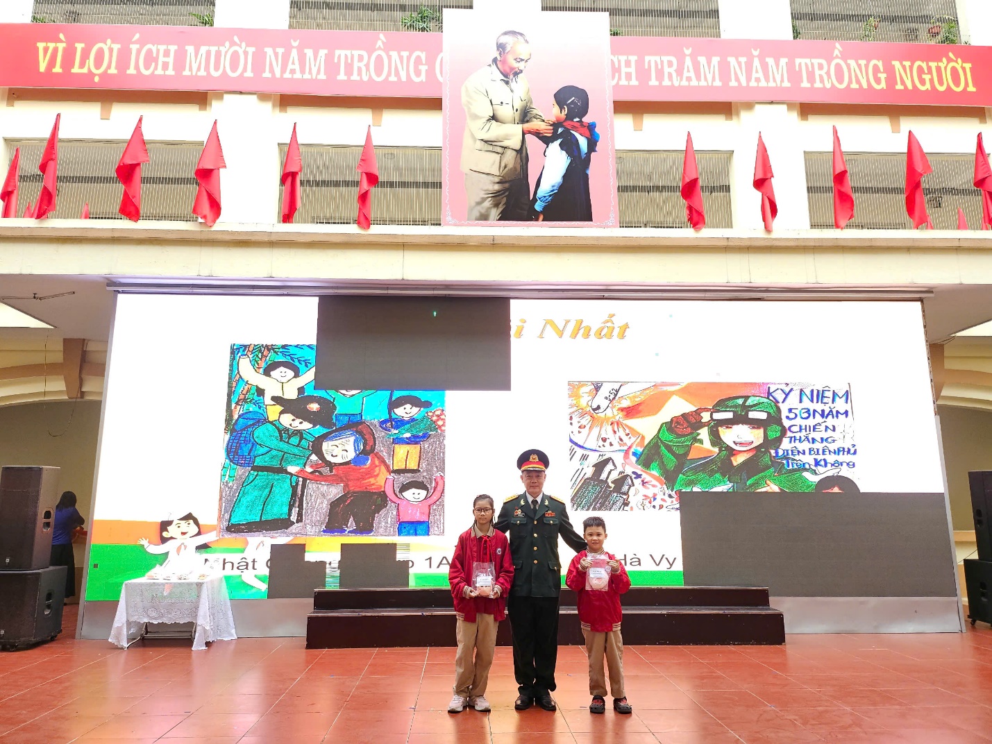 A group of people standing in front of a wall with flags

AI-generated content may be incorrect.