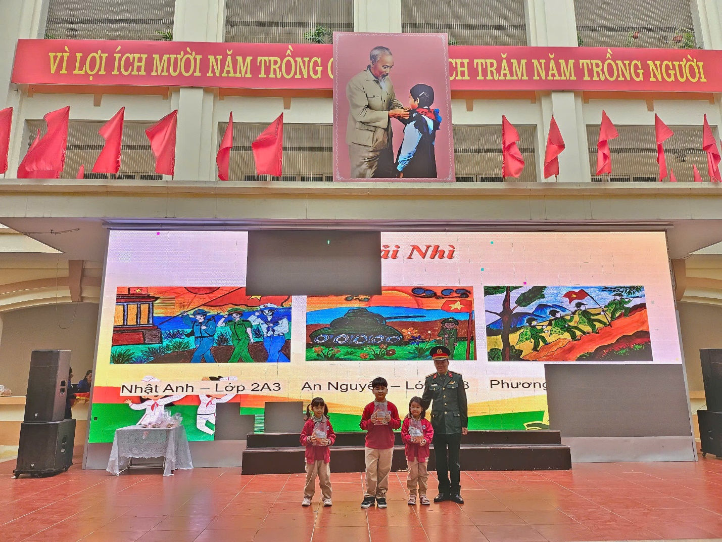 A group of people standing in front of a large stage

AI-generated content may be incorrect.