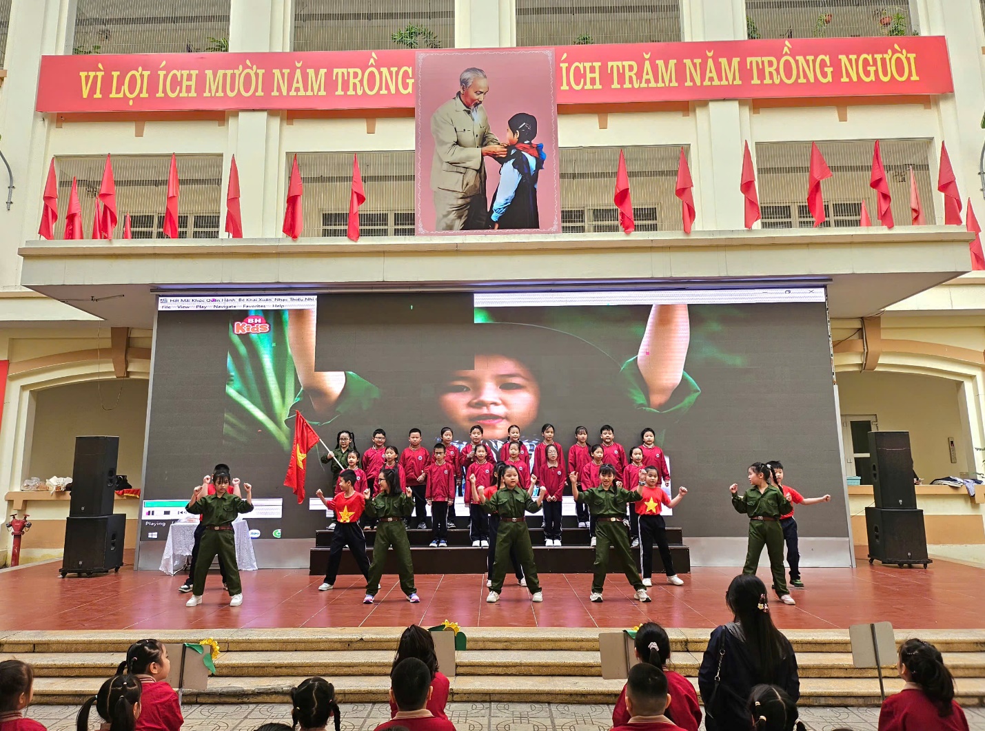 A group of people performing on a stage

AI-generated content may be incorrect.