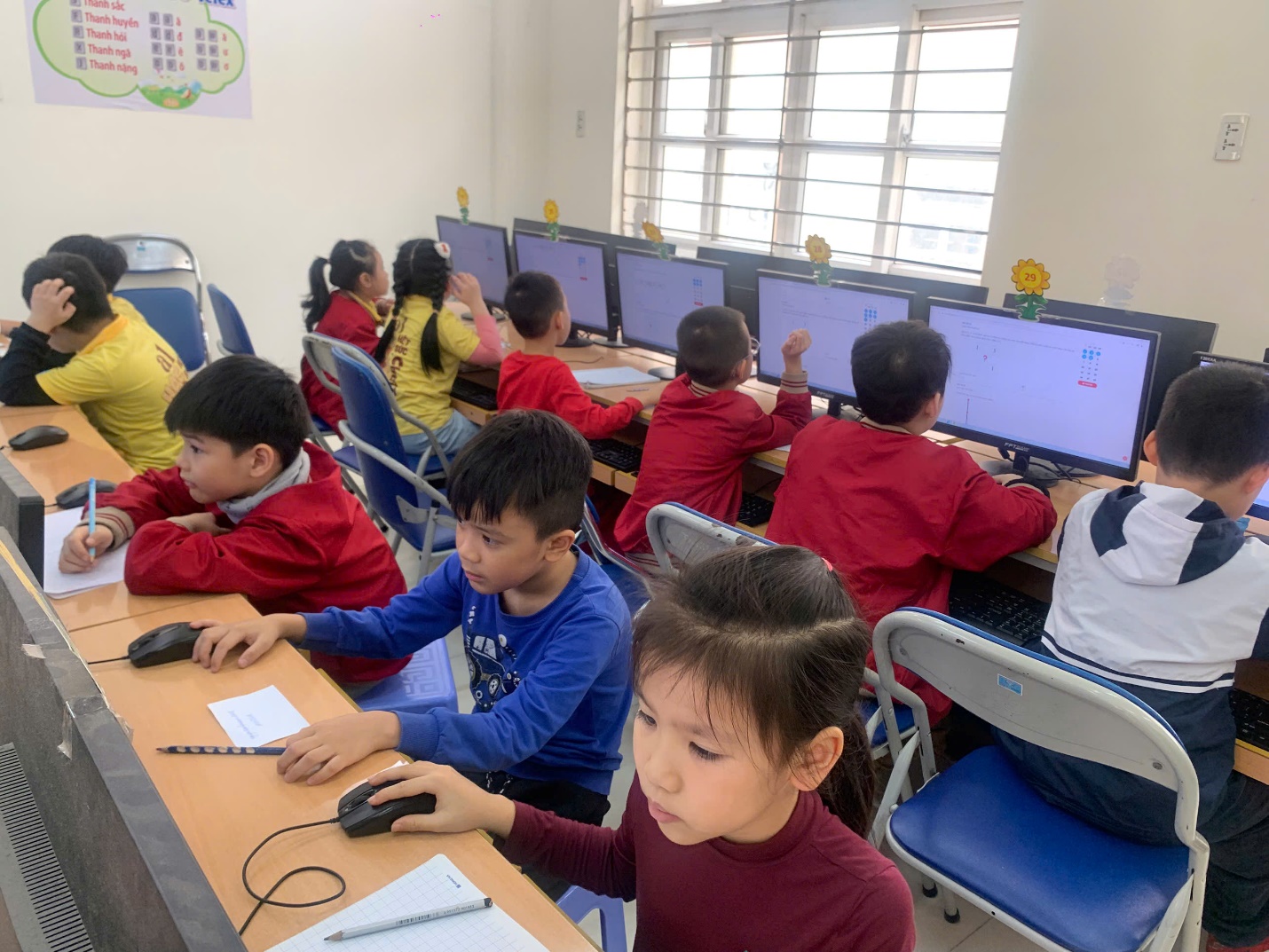 A group of children in a classroom using computers

AI-generated content may be incorrect.