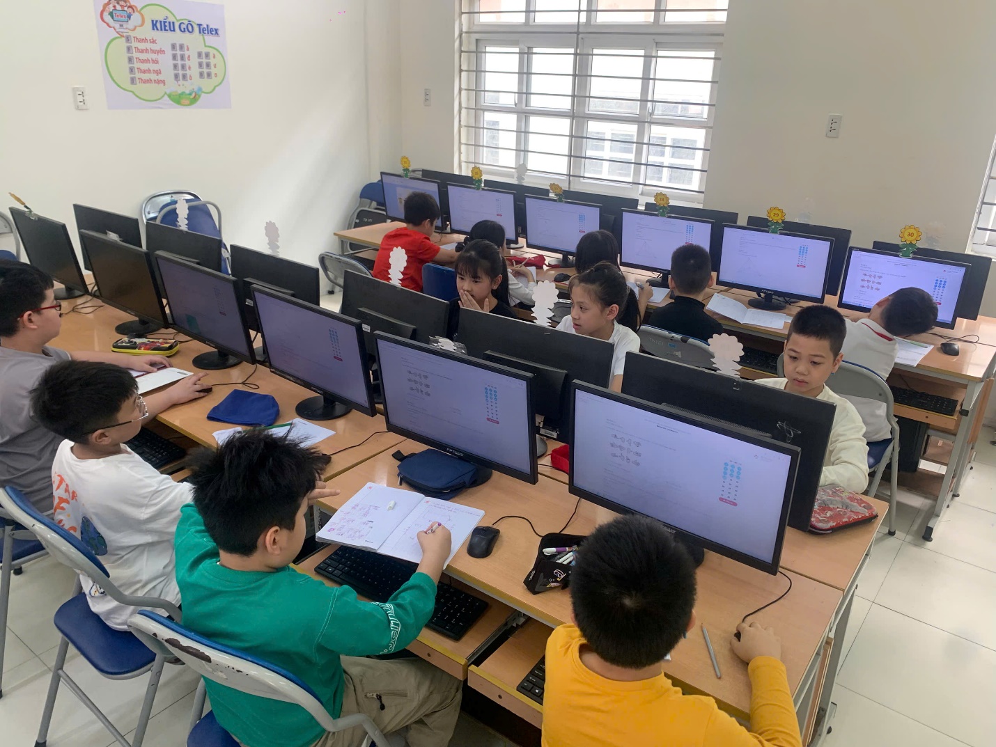 A group of children in a classroom with computers

AI-generated content may be incorrect.