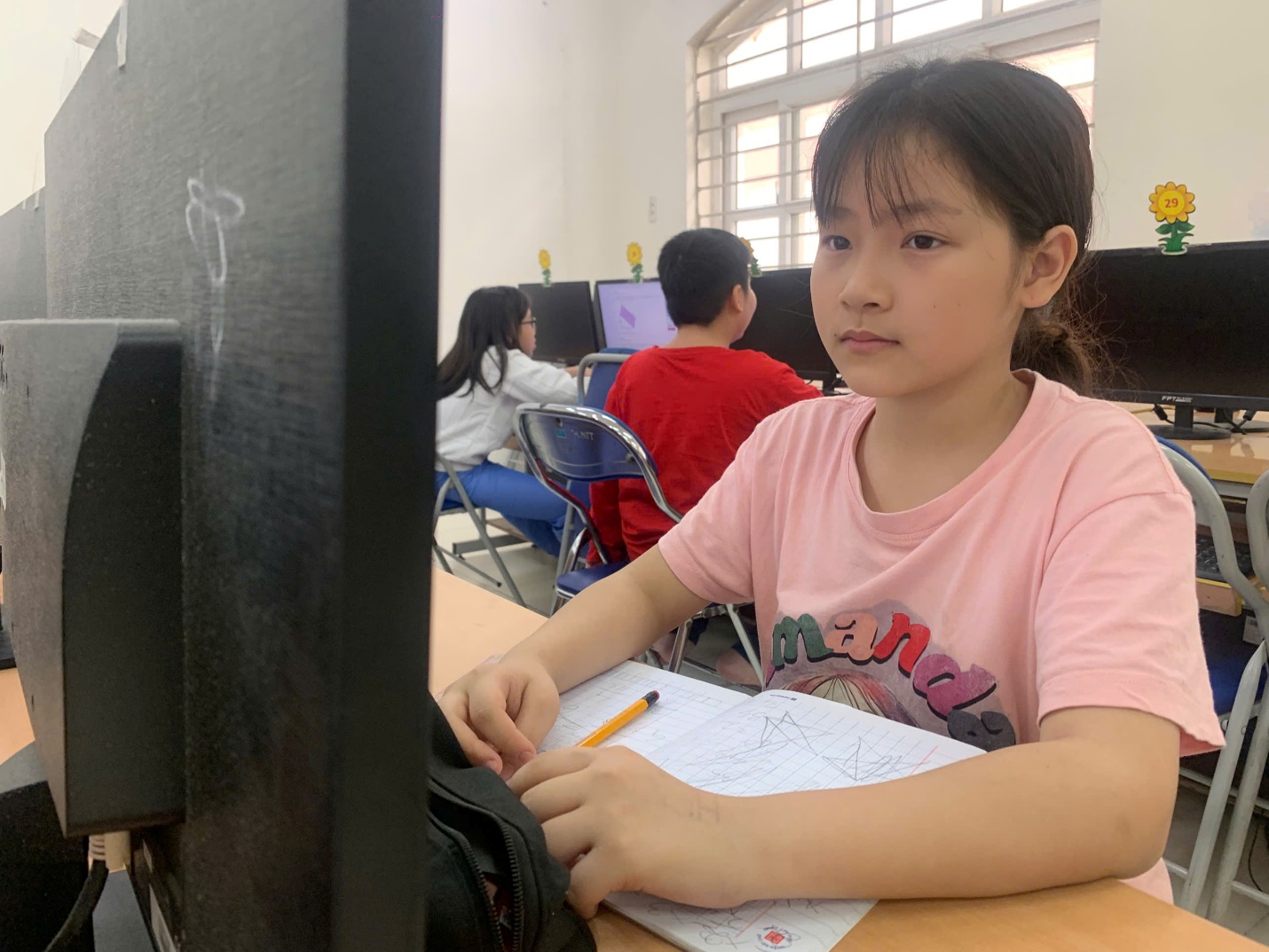 A child sitting at a desk in a classroom

AI-generated content may be incorrect.