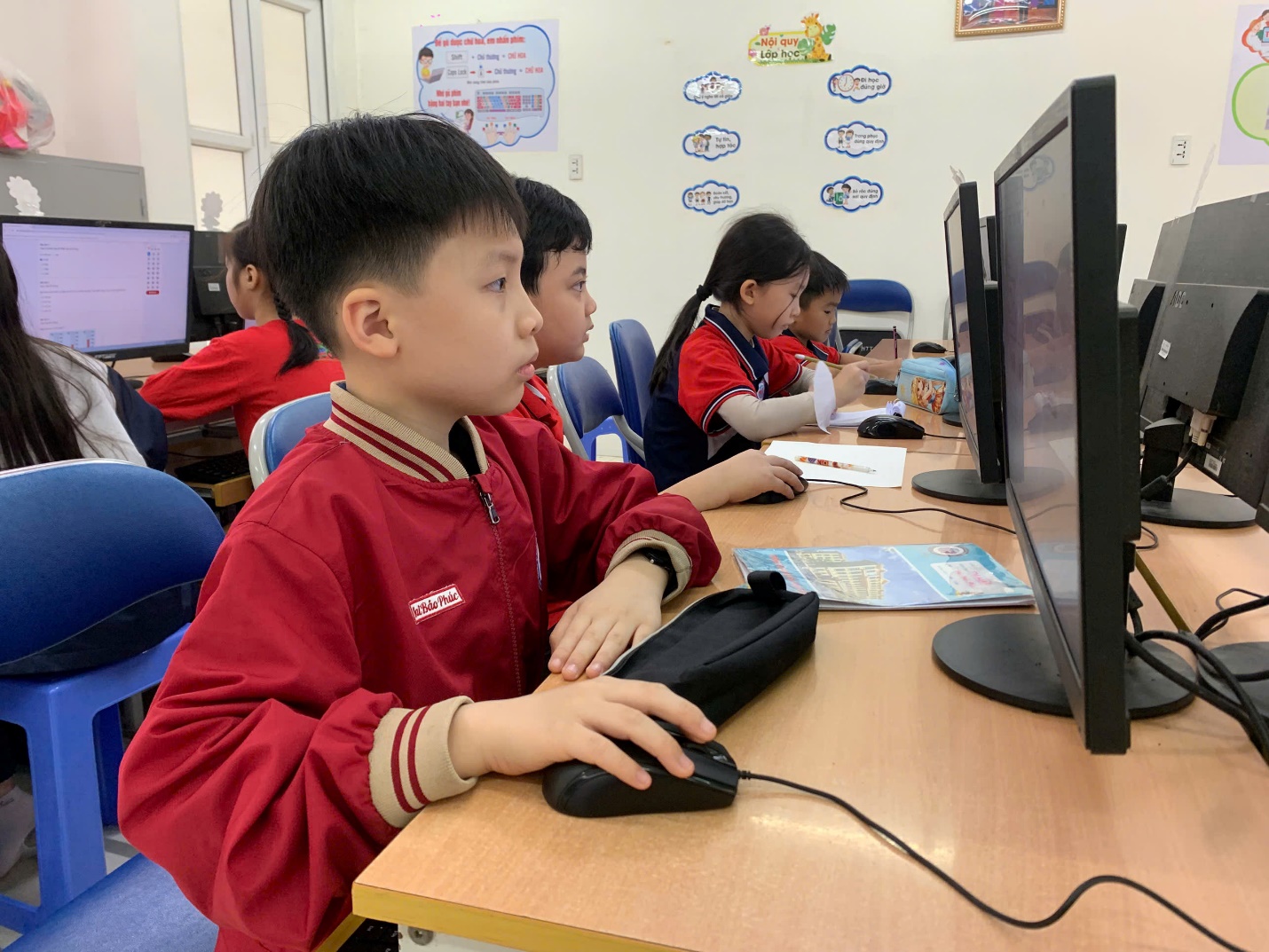 A group of children in a classroom using computers

AI-generated content may be incorrect.