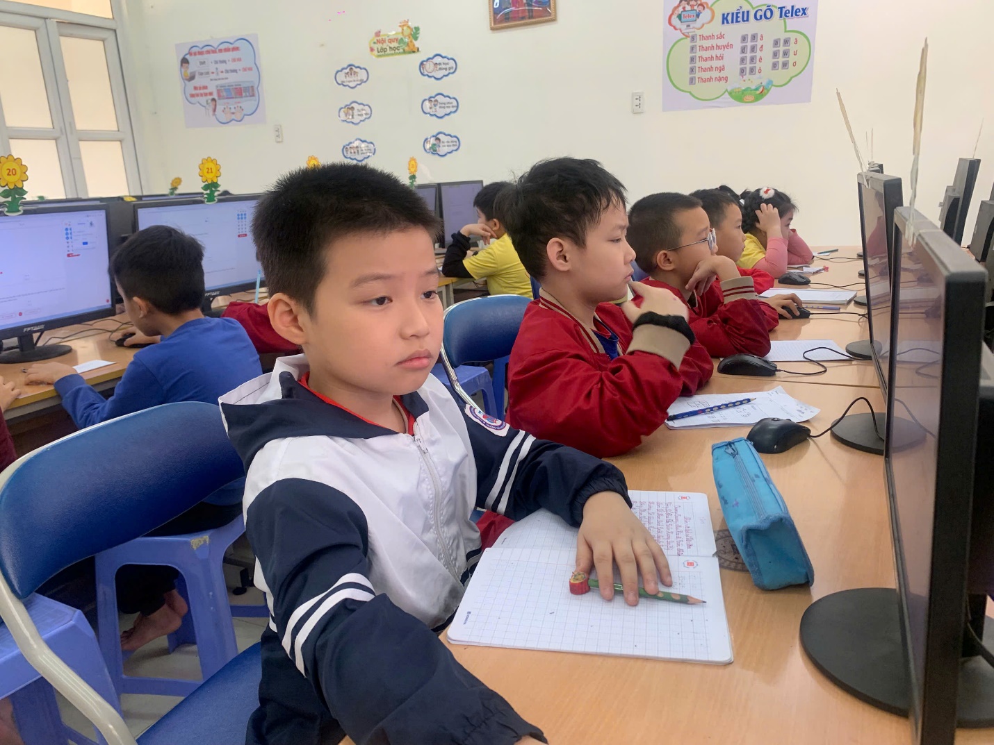 A group of children sitting at a desk

AI-generated content may be incorrect.