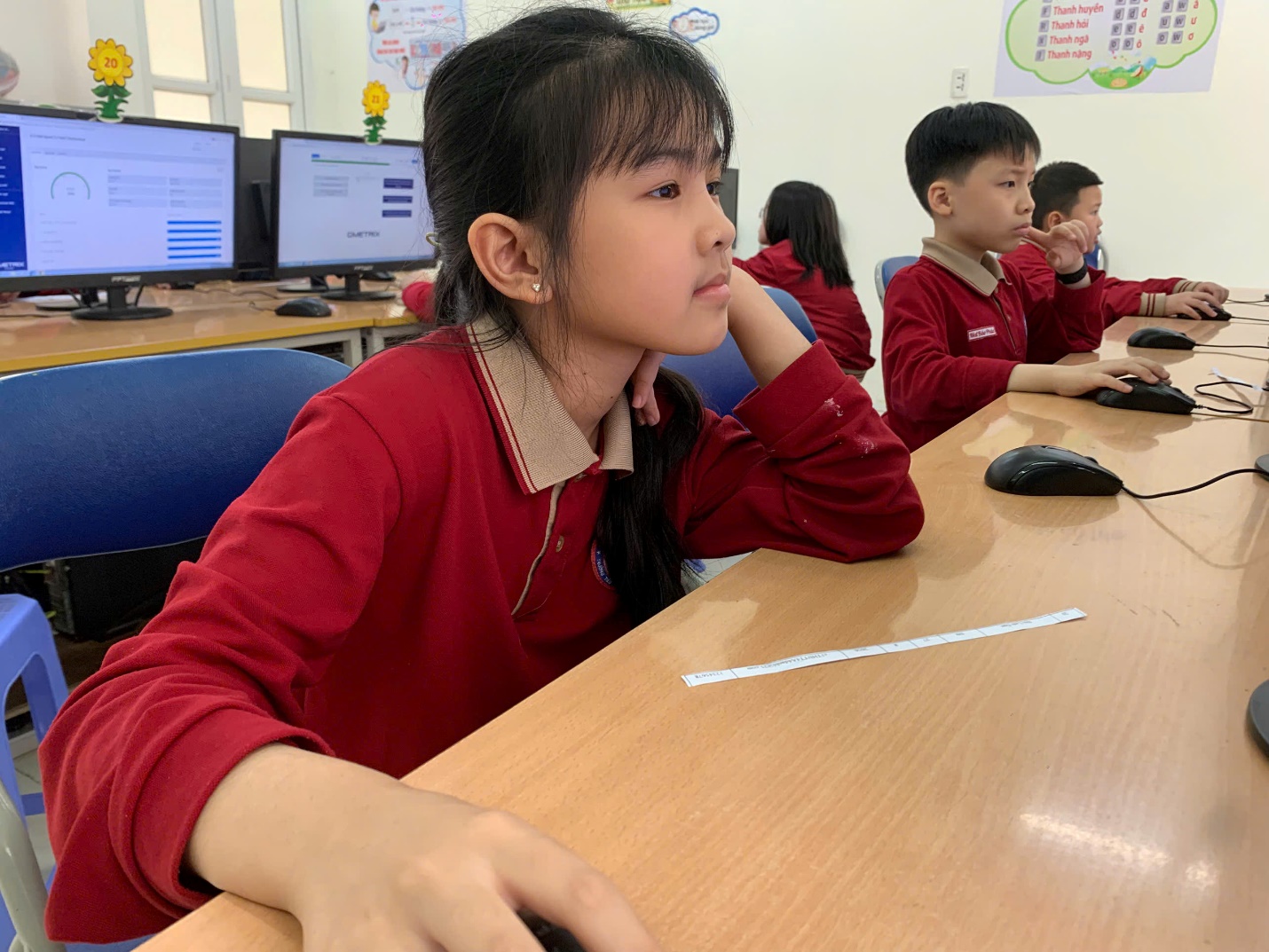 A group of children sitting at a desk

AI-generated content may be incorrect.