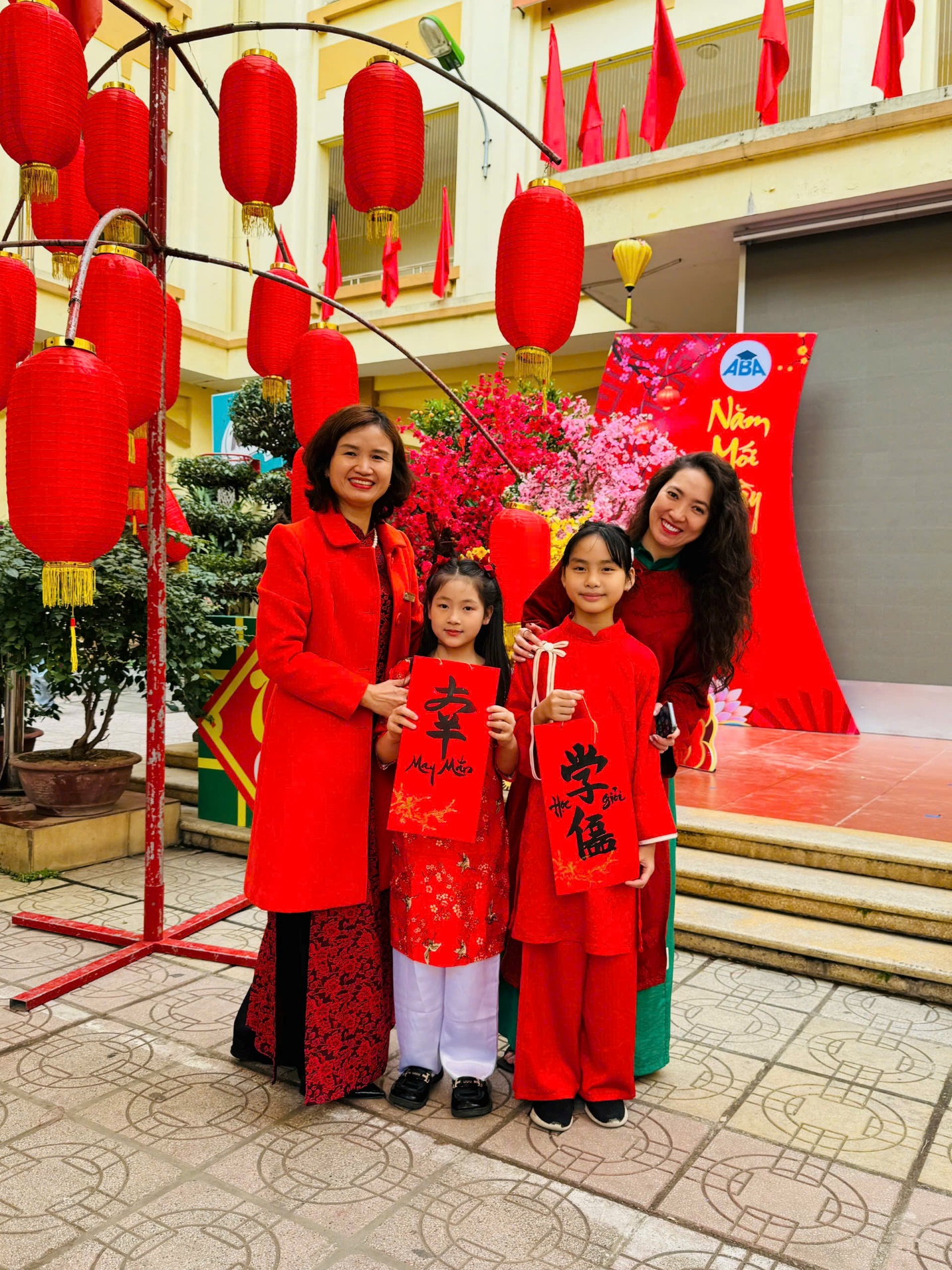 A group of people posing for a photo

Description automatically generated