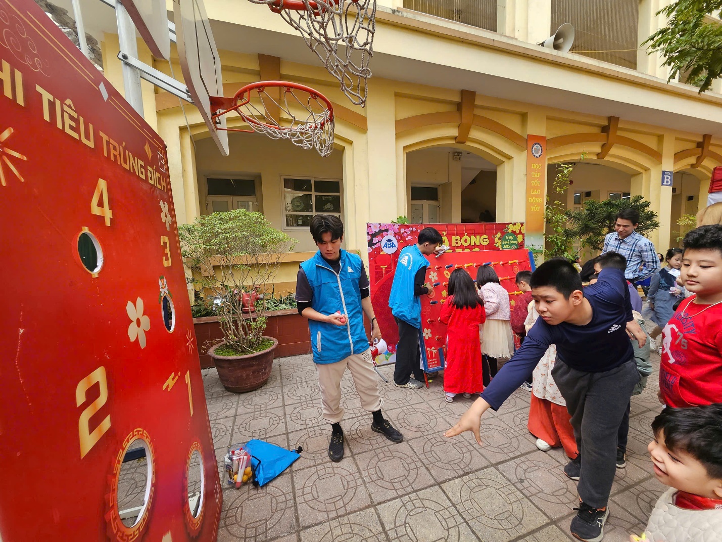 A group of people playing basketball

Description automatically generated