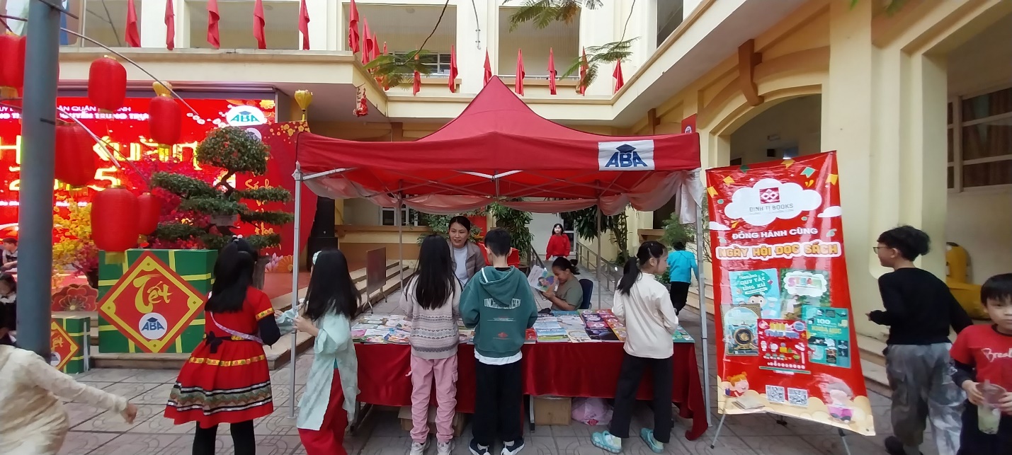 A group of people standing in front of a red tent

Description automatically generated