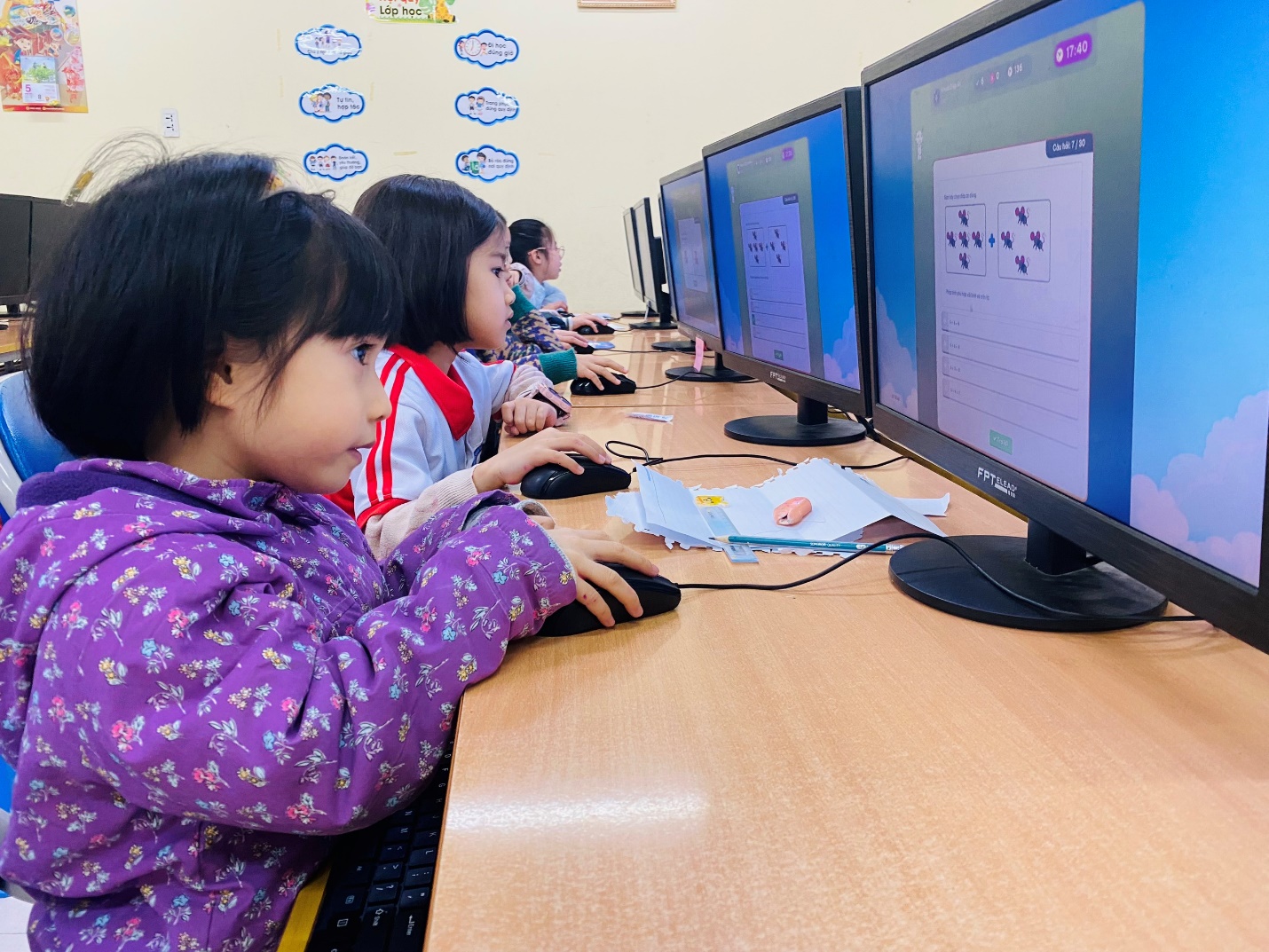 A group of children using computers

AI-generated content may be incorrect.