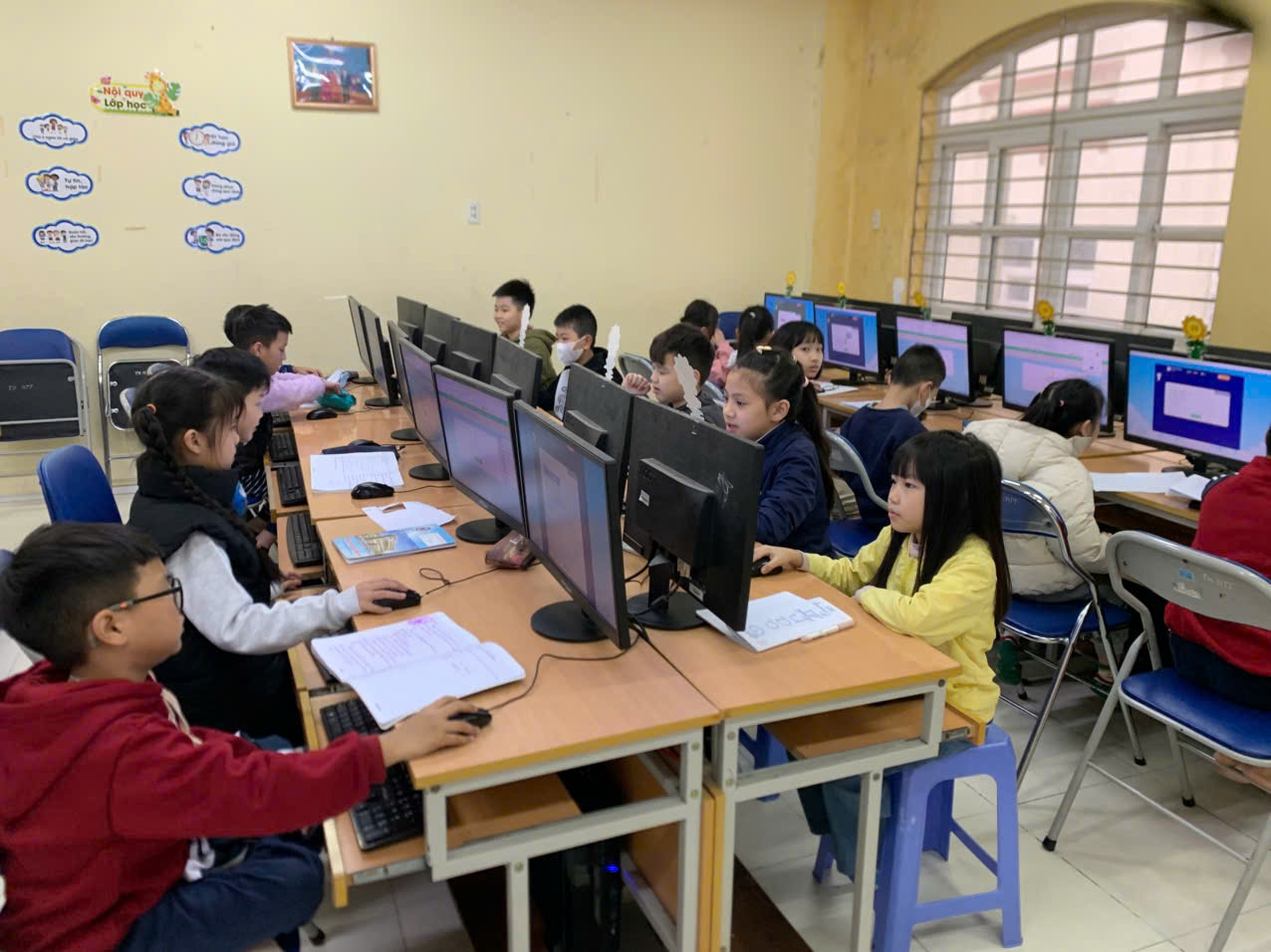 A group of children in a classroom using computers

AI-generated content may be incorrect.
